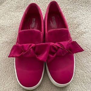 Snazzy hot pink Michael Kors slip on sneakers with cute bow